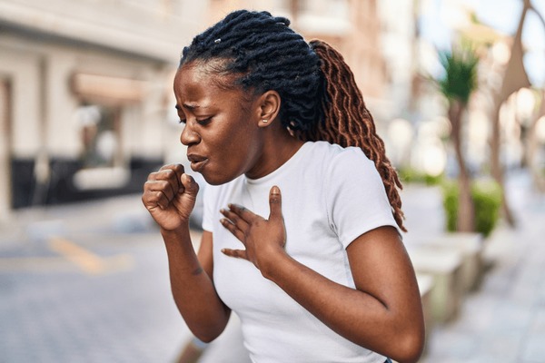 African Woman Coughing